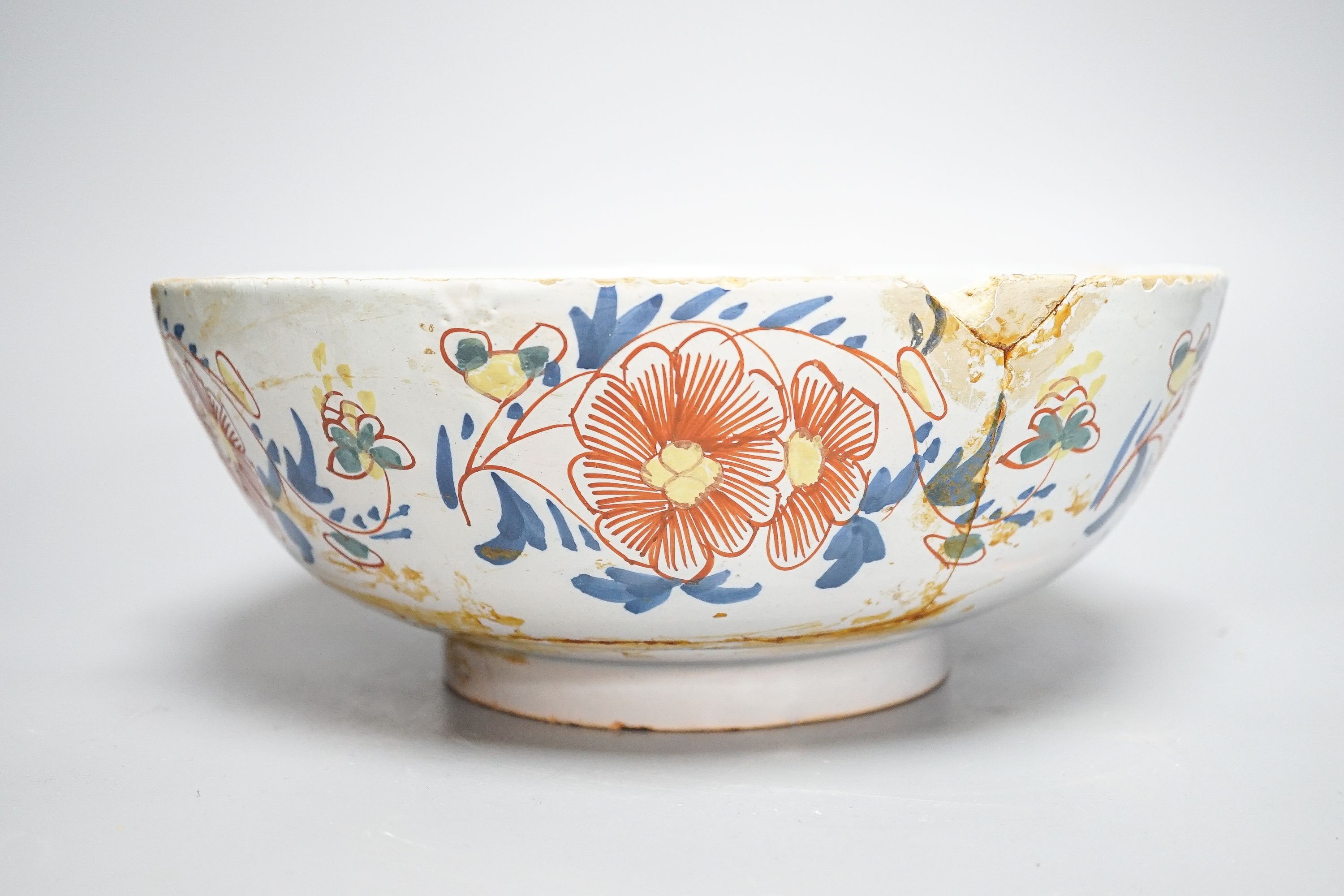 An 18th century English polychrome delftware bowl, interior inscribed 